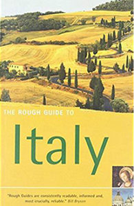 The cover of "Rough Guide Italy 2005," featuring a Tuscan landscape with golden grass and cypress trees